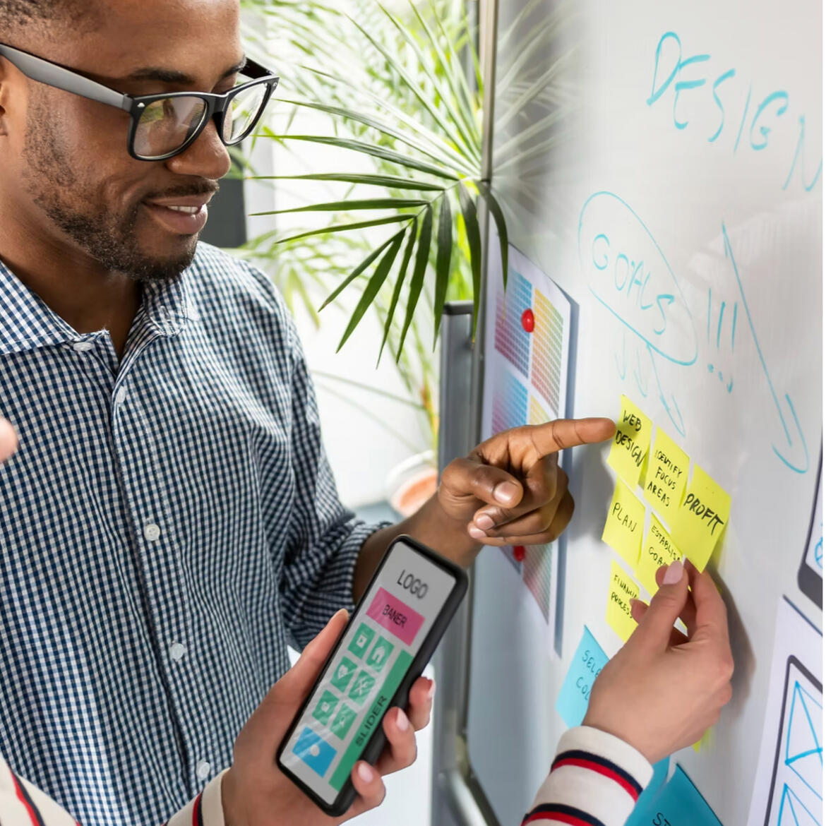 Services Marketing specialist working with client on a whiteboard