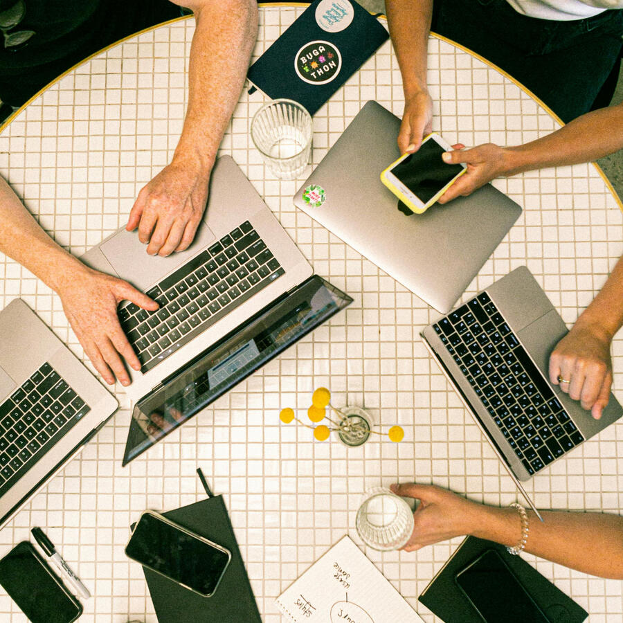 Team working on a marketing campaign on their laptops